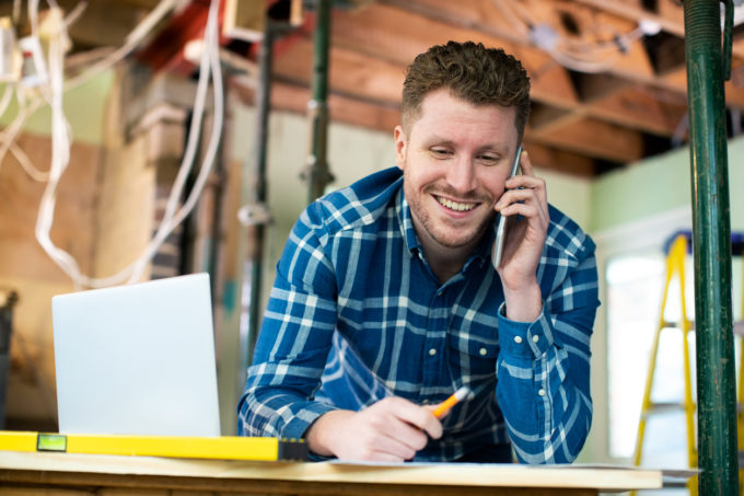 man on phone in worksite