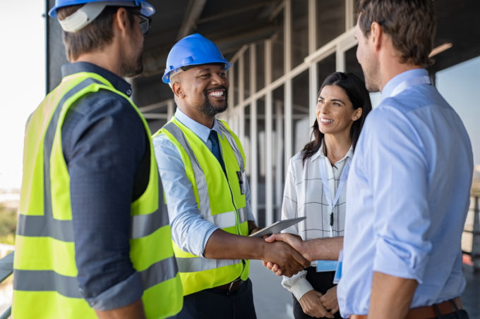 clients shaking hands with contractor