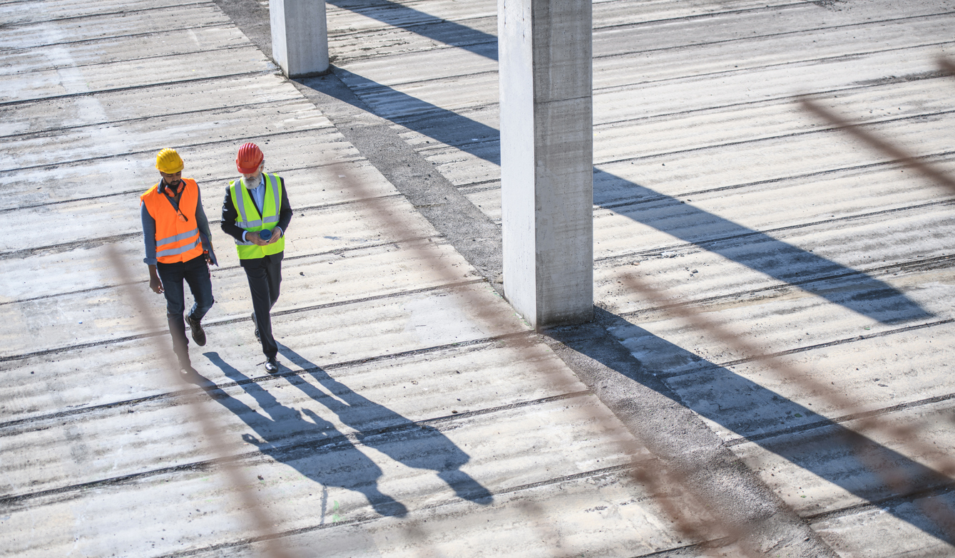 commercial roofers having a conversation on site